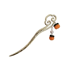 Golden Chinese hair pin with orange persimmon pendant and white pearl on white backdrop