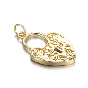 Detail showing golden heart padlock pendant with intricate vine pattern on white background