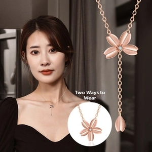 Detailed view of rose gold cherry blossom necklace featuring dual-mode wearing styles