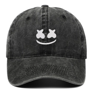 Close-up of vintage washed black cotton baseball cap with white embroidered smiley face