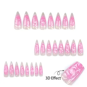 Extra long pink stiletto press-on nails with 3D embossed heart patterns and glitter