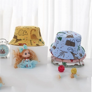 Toddler sun hat with cartoon dinosaur pattern in various pastel colors on a white display