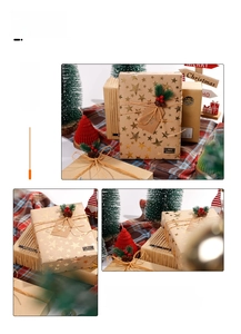 Close-up of brown kraft gift wrap with gold stars, twine, and pine berry decor clips