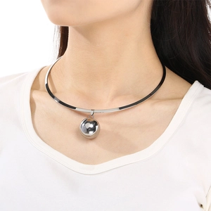Chic silver stainless steel collar necklace with a smooth spherical pendant on a model