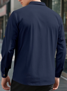 Detail of navy blue linen shirt fabric texture on man's back with high quality tailoring