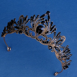 Baroque hollow wedding crown with black rhinestones in antique bronze finish on blue
