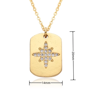 Detail view of a 20mm x 14mm gold octagonal star pendant with inset white zircon stone