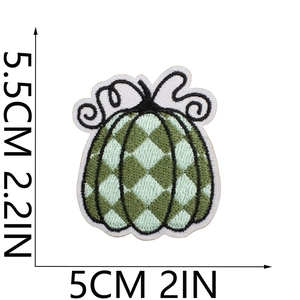 Detailed view of green checkered pumpkin patch embroidery with size measurements