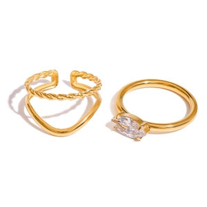 Stackable gold stainless steel ring set with twisted band and marquise cut zircon