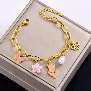 Golden titanium steel charm bracelet with pink enamel butterfly tulip and bee pendants