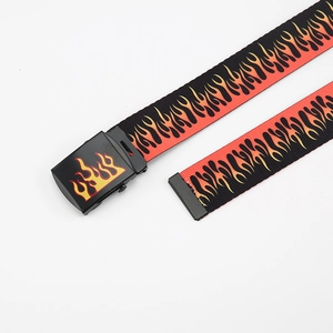 Detailed view of black canvas belt featuring vibrant red and orange flame patterns