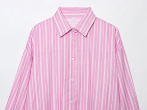 Detailed view of the pink and white striped shirt collar and fabric texture