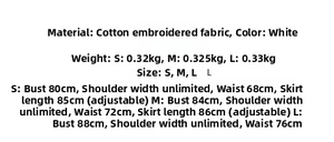 Gros plan détaillé de la broderie en dentelle de coton blanc sur une robe corset