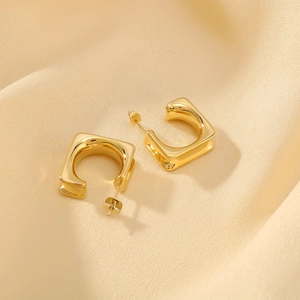 Minimalist 18k gold plated stainless steel square C-shaped earrings on beige silk fabric