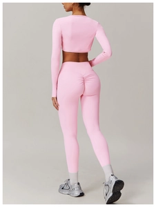 Rear view of pink yoga set showing high-waisted leggings with ruched butt lifting detail