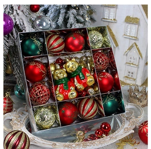 Detail view of assorted red, gold and green Christmas ornaments with cute bear pendants