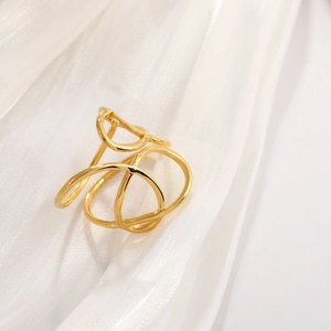 French vintage irregular gold titanium steel ring with wavy lines on white silk fabric