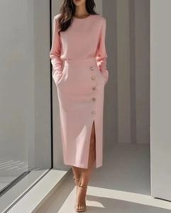 Pink long sleeve two-piece dress set with gold button detail and elegant side slit