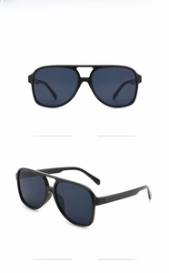 Detail view showing front and side angles of black oversized retro aviator sunglasses