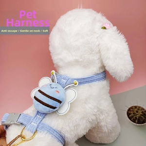 Detail of adjustable blue bee pet harness with soft fabric and secure metal D-ring attachment