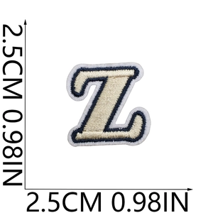 Detail of embroidered letter Z patch with navy border and white stitching 2.5cm size