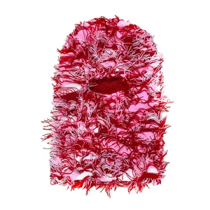 Close-up of pink and red distressed knit balaclava with frayed fringe and eye opening
