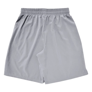 Detail of grey quick-dry sports shorts showing the elastic waistband and fabric texture