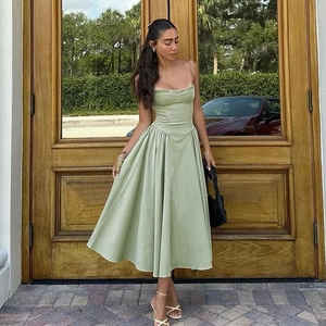 French vintage style light green midi dress with corset bodice and pleated A-line skirt