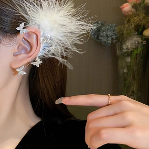 Elegant butterfly ear cuff with silver rhinestones and white feather detail for women