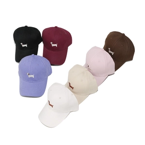 Multiple colors of cotton baseball caps featuring cute dachshund puppy embroidery detail