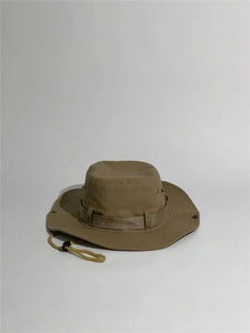Detail of outdoor sun hat with breathable metal eyelets and adjustable chin cord