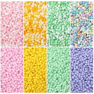 Detailed grid view of assorted macaron colored beads for DIY handmade jewelry crafts