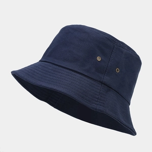 Close-up of navy blue bucket hat featuring metal eyelets and reinforced stitching