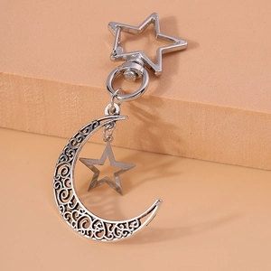 Silver hollow moon and star keychain accessory for handbags with celestial metal pendants