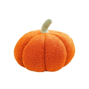 Cute orange pumpkin plush pillow in teddy fleece fabric with green stem on white background