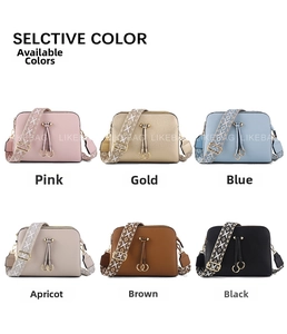 Detail of crossbody bag with wide jacquard straps and double tassel in six colors