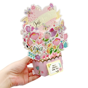 3D pop-up Children's Day greeting card featuring a floral gift basket with butterflies