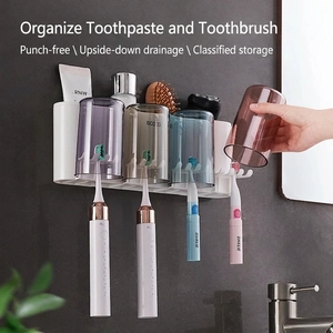 Wall-mounted toothbrush holder with four colorful cups and multi-functional storage rack