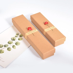 Brown kraft paper jewelry boxes with red paper roses and Just For You ribbon detail