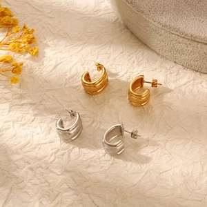 Irregular C-shaped stainless steel earrings in gold and silver finishes for women