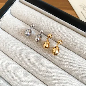 Boucles d'oreilles gouttes minimalistes en plaqué or 18 carats et argent au fini miroir