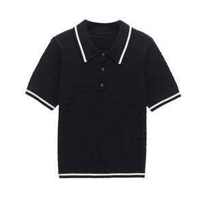 Close-up of cable knit texture on polo shirt with contrast white stripes and buttons