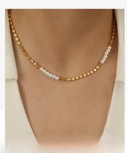 Close-up of minimalist golden bead necklace with elegant freshwater pearl accents