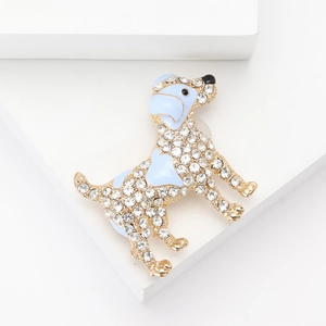 Detail of a dog brooch with light blue enamel, gold alloy, and sparkling rhinestones