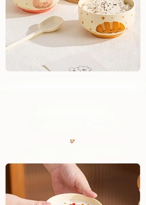 Detailed view of yellow ceramic soup bowl with cute croissant and star illustrations