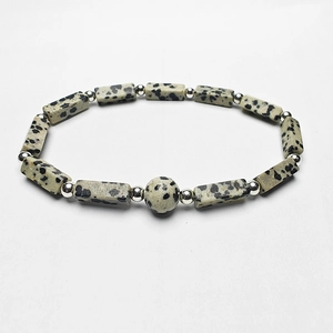 Detailed close-up of Dalmatian Jasper beads and silver spacers on a fashion stone bracelet