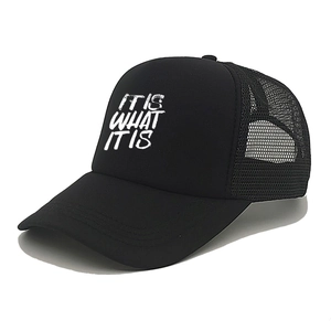 Classic black trucker hat with white 'IT IS WHAT IT IS' text and breathable mesh back