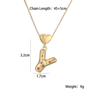 Detail of 18K gold letter Y pendant necklace with colorful stones and measurement specs