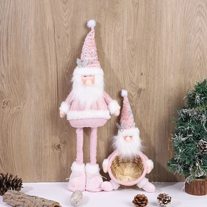 Pink sequin Christmas gnome figurines with white fur beards and a small wooden basket