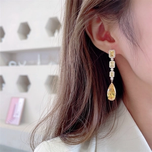 Elegant long champagne yellow drop earrings with zircon crystals for evening wear